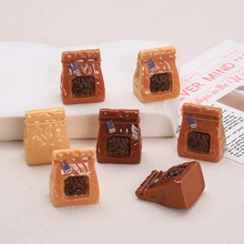 Macro shot of 7 miniature DIY resin M-bean bags in light and dark brown colors