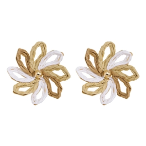 Detail of handmade raffia woven flower earrings with tricolor petals and gold beads