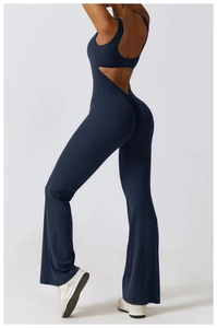 Detail of navy blue high-waist flared yoga jumpsuit with backless cutout design