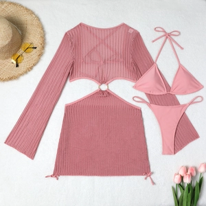 Flat lay of pink three-piece bikini set with mesh cover-up and metal ring details