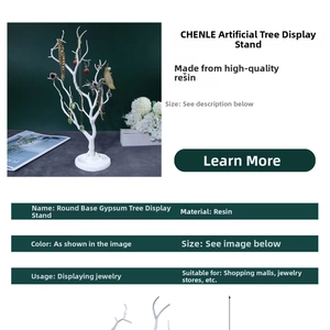 White resin tree branch jewelry stand with solid round base for necklaces and earrings