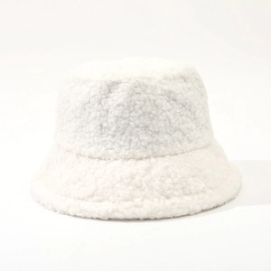 Close-up of soft white lamb wool texture on a minimalist fisherman bucket hat