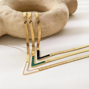 Three V-shaped 18K gold plated snake chain necklaces with shell, malachite, and enamel pendants