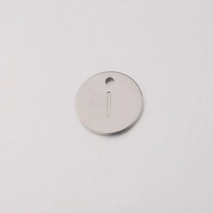 Detailed macro view of a 12mm silver stainless steel round pendant with letter I engraving