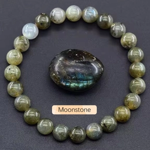 Detail view of moonstone beaded bracelet with blue sheen and natural raw stone