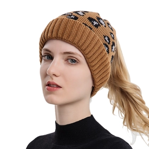 Women's leopard print knit ponytail beanie with wide ribbed cuff for winter warmth
