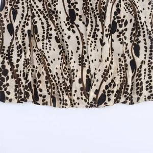 Brown leopard print halter dress featuring lightweight chiffon fabric and hemline details