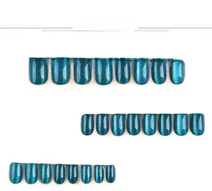 Detail view of 24pcs short square press-on nails with deep emerald green cat eye effect