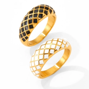 Detail of French-style black and white checkerboard enamel pattern on gold-plated rings