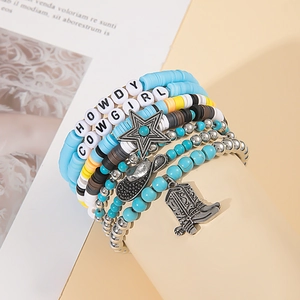 Detail of multi-layer boho beaded bracelets with western charms like cowboy boots and hats