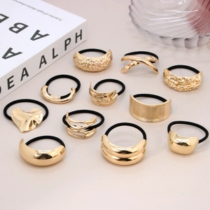 Set of 11 irregular gold alloy hair ties with minimalist geometric and heart designs