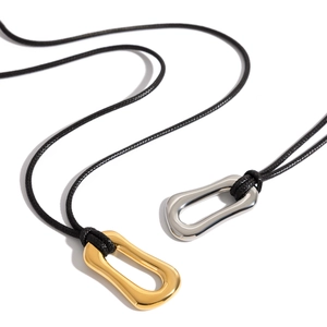 Minimalist 18K gold and silver irregular O-shaped pendants on black wax cord necklaces