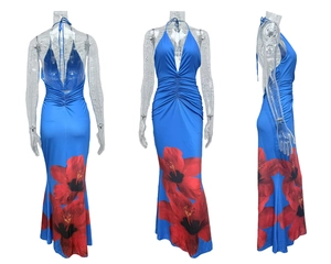 Detail view of the halter neck tie and ruched blue dress with red floral print patterns