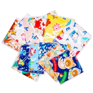 Close-up of multiple printed pet bandanas with cute cartoon crab and cat patterns