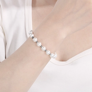 Detail of freshwater pearl bracelet with silver metal beads worn on a wrist