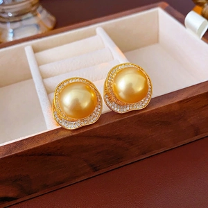 French vintage style gold pearl stud earrings with zircon halo in a luxury jewelry box
