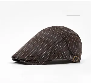 Close-up of brown striped flat cap with adjustable metal side buckle and fabric texture