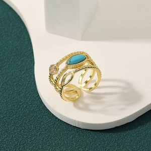 Multi-layer gold open ring with marquise turquoise and pave zircon on geometric stand