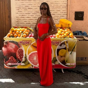 Fashionable red two-piece set featuring a camisole top and long pants in soft fabric