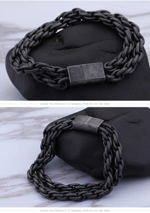Detail view of multi-strand braided vintage steel bracelet with rectangular metal clasp
