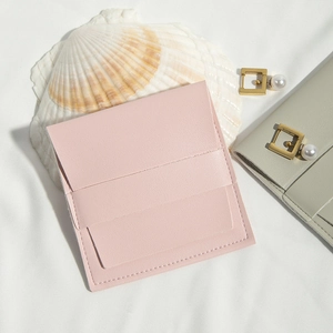 Detail of pink PU leather jewelry pouch with neat stitching and flip closure