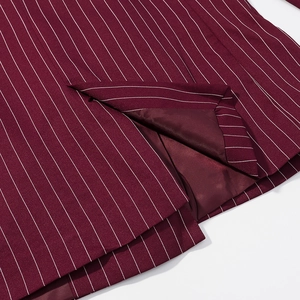 Detail of the back slit on a burgundy pinstripe blazer with high-quality stitching