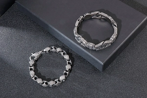 Macro shot of retro geometric steel bracelets with carved patterns and vintage silver finish