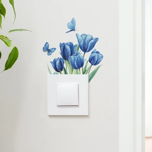 Detailed blue tulip and butterfly wall sticker decorating a light switch panel
