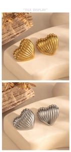 Close-up of geometric heart stud earrings with shell texture in gold and silver finish