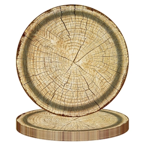 Close-up of disposable round plates with natural wood grain and tree ring patterns