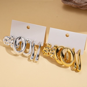 Detail of 6-piece geometric earring set in gold and silver finish on display cards