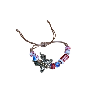 Vintage butterfly charm woven bracelet with colorful ceramic beads in bohemian style