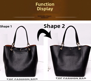 Detail of black pebbled leather tote bag showing two functional shapes and orange lining