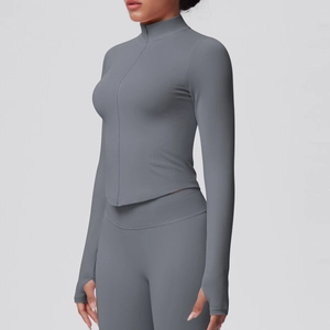 Detail of high-stretch yoga jacket with stand collar and thumbhole sleeves in dark grey