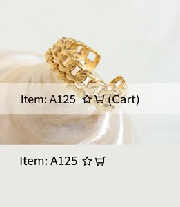 Detail of a golden cuban link style open ring with polished metal texture finish