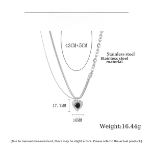 Detail view of black heart pendant necklace with size parameters and stainless steel specs