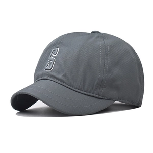 Detail of dark grey quick-dry cap with 3D embroidered white S letter and mesh texture