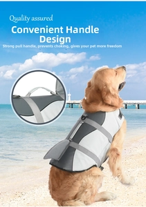 Detail of dog life jacket featuring shark fin design and sturdy rescue handle on back