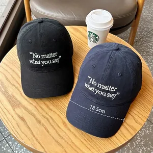 Deep crown baseball cap in black and navy with wide 18.5cm brim and letter embroidery