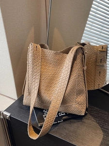 Retro khaki tote bag with woven texture and mirror reflection showing front and back views