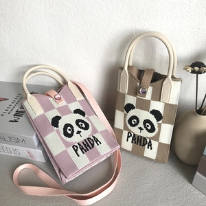 Knitted panda phone bag with round handles and crossbody strap in pink and brown patterns