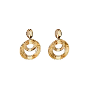 Golden spiral wrap round metal hoop earrings with minimalist geometric design on white backdrop