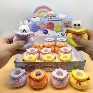 Detail showing hands squeezing a colorful Cuddly Bear福袋 squeeze toy for stress relief