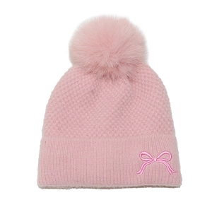 Close-up of pink knit hat featuring soft fleece lining and delicate bow embroidery