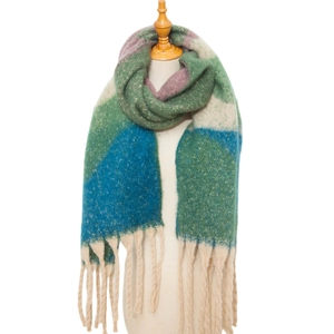 Detail of colorful chunky knit scarf with long tassels on a wooden display mannequin