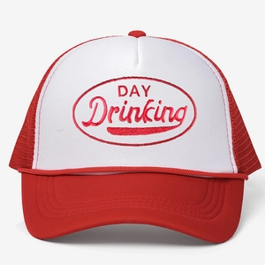 Detailed close-up of embroidery on a red and white mesh trucker hat with Day Drinking text