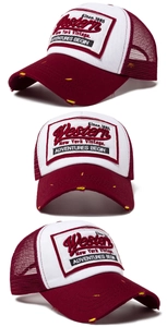 Detail of vintage Western patchwork trucker hat with burgundy mesh and distressed brim