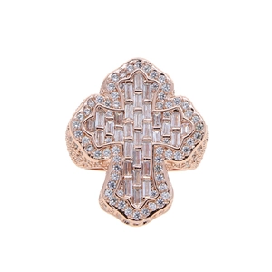 Close-up of hip hop rose gold cross ring with baguette and round cut zircon stones