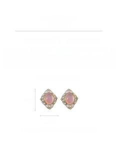 Detail view of vintage style pink oval resin earrings with rhinestones and silver pins