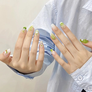 Handmade press-on nails with green frog patterns and leaf textures in a glossy finish